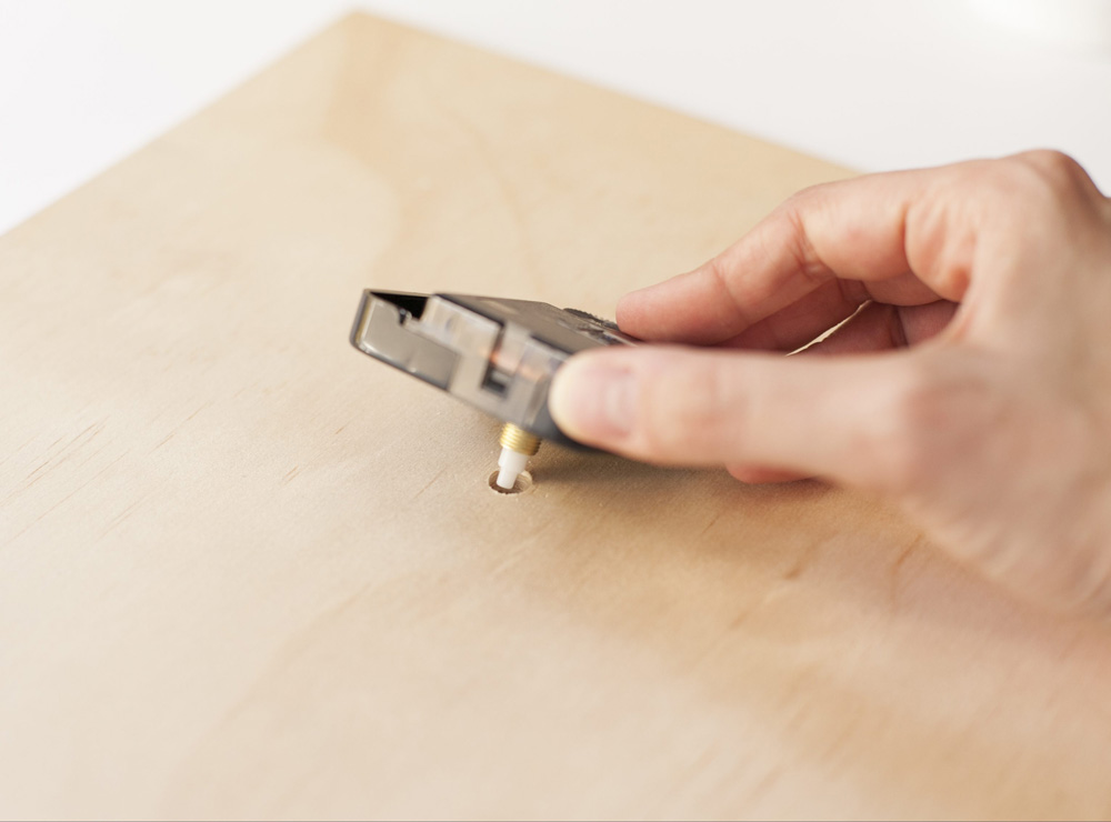 Installing a clock mechanism.